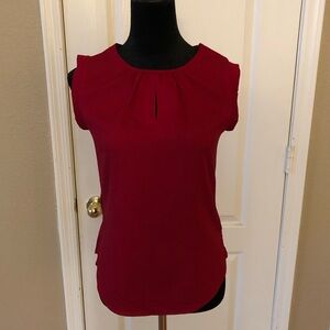 Red sleeveless blouse